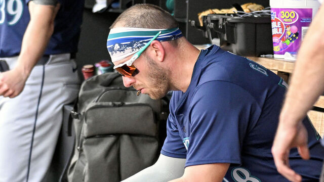 WASHINGTON, DC - May 26: Seattle Mariners designated hitter Mitch Garver (18) looks at a computer during the Seattle Mariners versus the Washington Nationals on May 26, 2024 at Nationals Park in Washington, D.C.