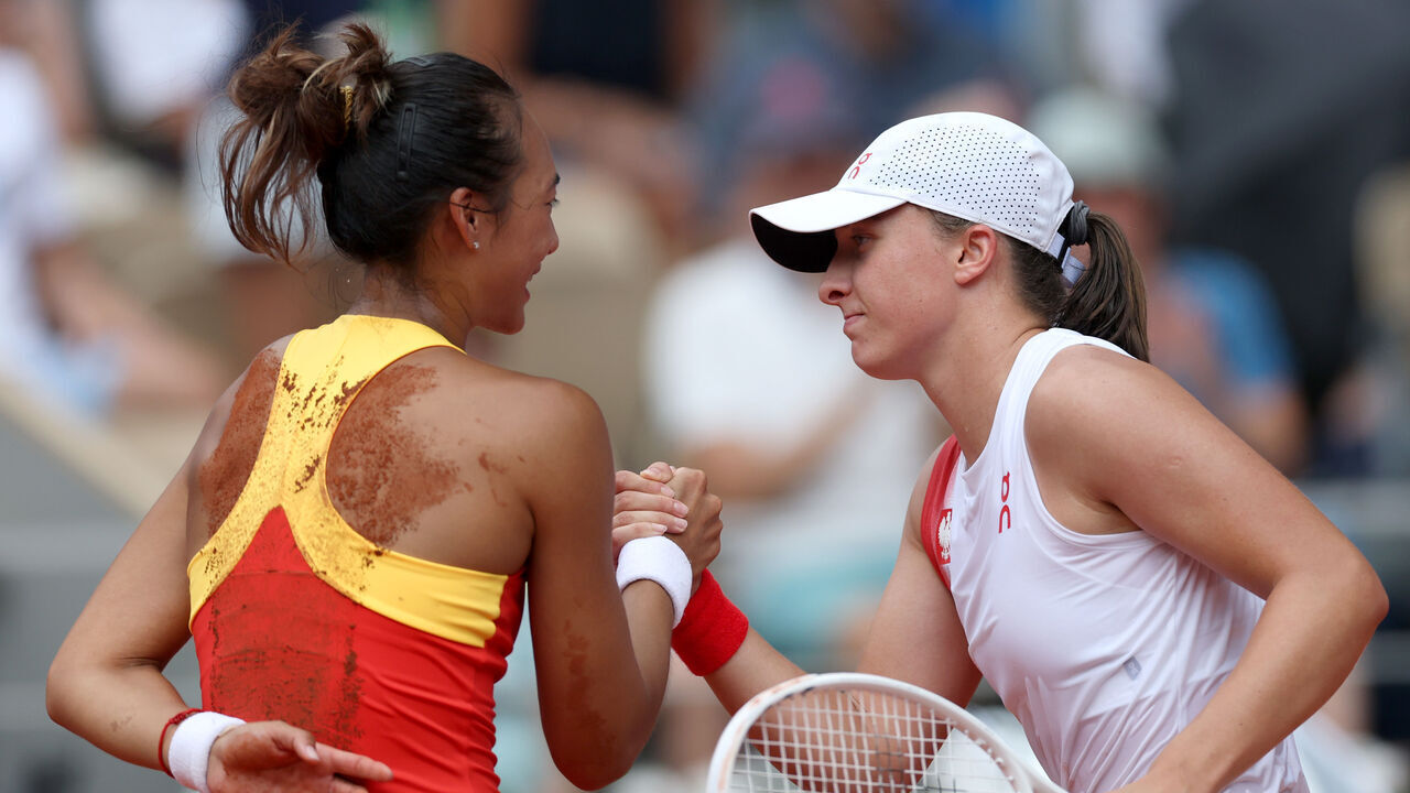 PARIS, FRANCE - AUGUST 01: Qinwen Zheng of Team People's Republic of China and Iga Swiatek of Team Poland shake hands during the Women's Singles Semi-final match on day six of the Olympic Games Paris 2024 at Roland Garros on August 01, 2024 in Paris, France.