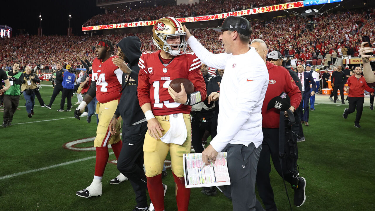 SANTA CLARA, CALIFORNIA - JANUARY 28: Brock Purdy #13 of the San Francisco 49ers celebrates with Head coach Kyle Shanahan after defeating the Detroit Lions 34-31 in the NFC Championship Game at Levi's Stadium on January 28, 2024 in Santa Clara, California.