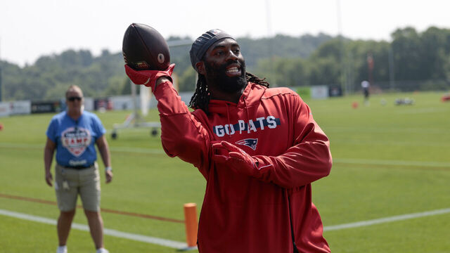 FOXBOROUGH, MA - JULY 28: New England Patriots outside linebacker Matthew Judon (9) plays catch with the fans during New England Patriots Training Camp on July 28, 2024, at Gillette Stadium in Foxborough, Massachusetts.