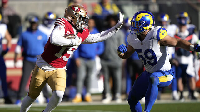 SANTA CLARA, CALIFORNIA - JANUARY 07: Deebo Samuel #19 of the San Francisco 49ers running with the ball fights off the tackle of Troy Reeder #59 of the Los Angeles Rams during the first quarter of an NFL football game at Levi's Stadium on January 07, 2024 in Santa Clara, California.