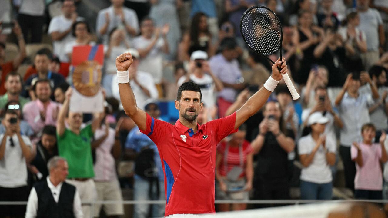 Serbia's Novak Djokovic celebrates after his win over Greece's Stefanos Tsitsipas in their men's singles quarter-final tennis match on Court Philippe-Chatrier at the Roland-Garros Stadium during the Paris 2024 Olympic Games, in Paris on August 1, 2024.