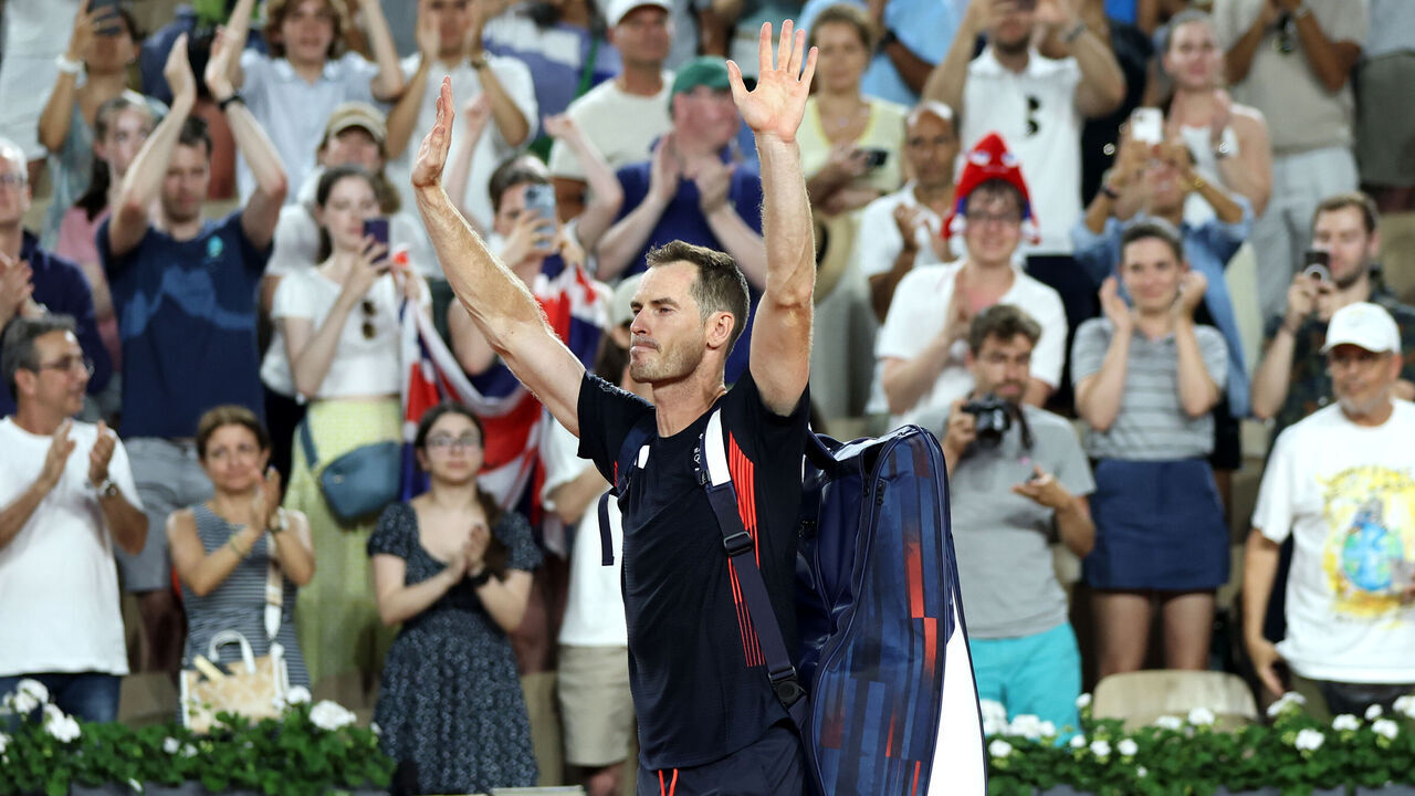 PARIS, FRANCE - AUGUST 01: Andy Murray of Team Great Britain acknowledges the crowd with partner (not in frame) Daniel Evans of Team Great Britain after losing match point against Taylor Fritz of Team United States and Tommy Paul of Team United States during the Men's Doubles Quarter-final match on day six of the Olympic Games Paris 2024 at Roland Garros on August 01, 2024 in Paris, France.