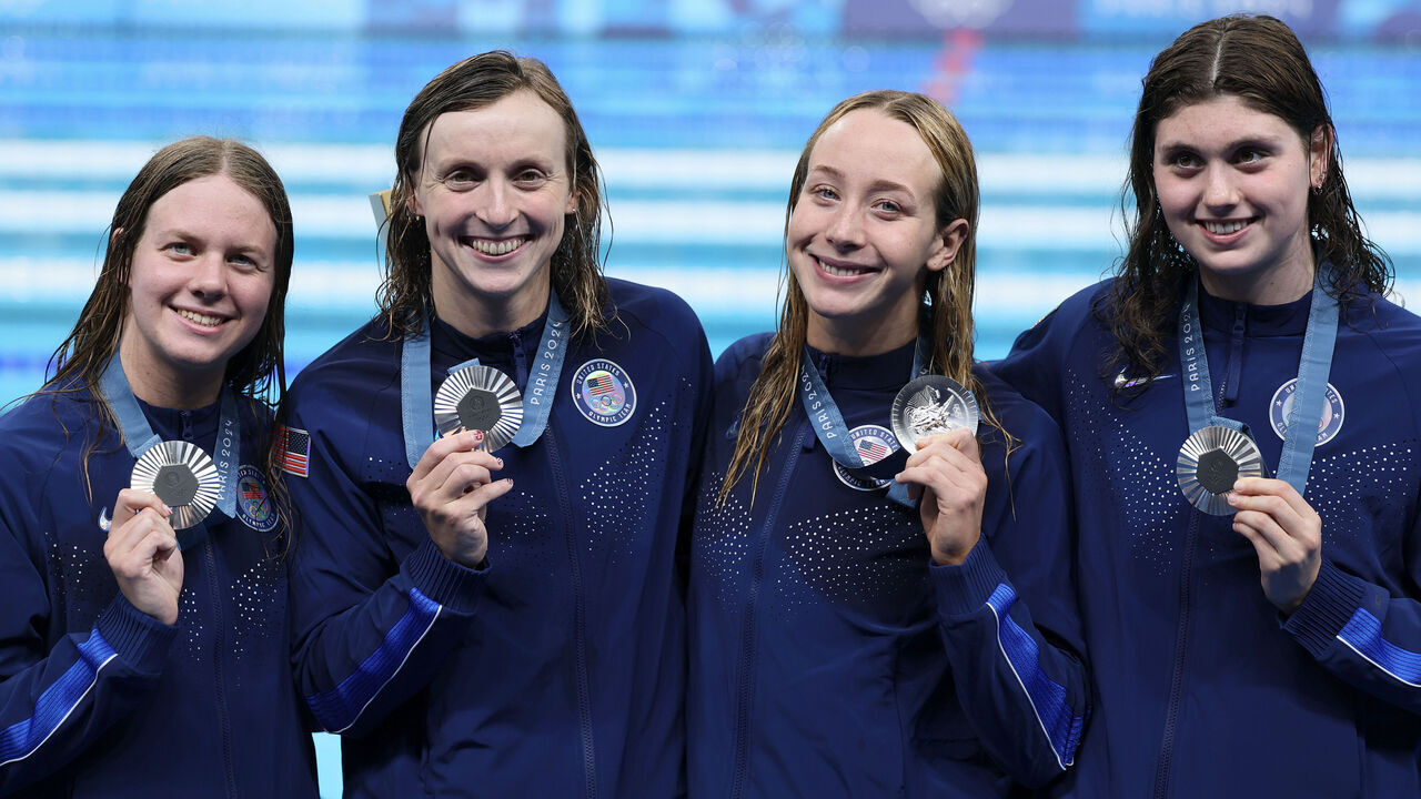 NANTERRE, FRANCE - AUGUST 01: Silver Medalists Claire Weinstein, Paige Madden, Katie Ledecky and Erin Gemmell of Team United States pose following the Swimming medal ceremony after the Women's 4x200m Freestyle Relay Final on day six of the Olympic Games Paris 2024 at Paris La Defense Arena on August 01, 2024 in Nanterre, France.