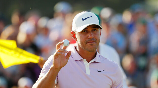 AUGUSTA, GEORGIA - APRIL 13: Brooks Koepka of the United States acknowledges patrons after putting on the 18th green during the third round of the Masters at Augusta National Golf Club on April 13, 2019 in Augusta, Georgia.