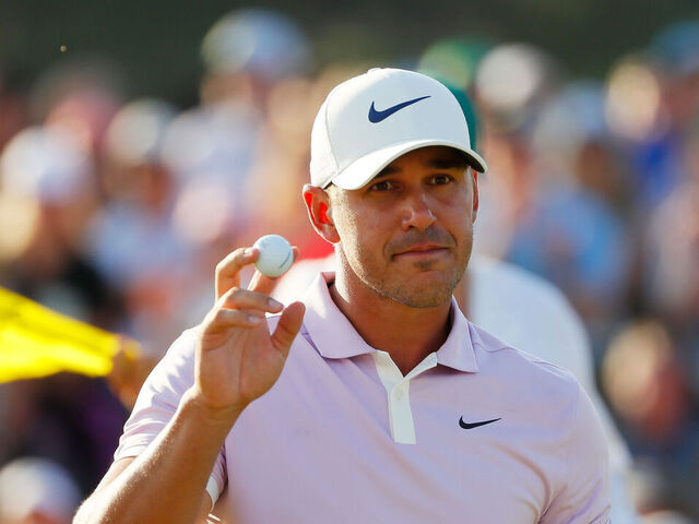 AUGUSTA, GEORGIA - APRIL 13: Brooks Koepka of the United States acknowledges patrons after putting on the 18th green during the third round of the Masters at Augusta National Golf Club on April 13, 2019 in Augusta, Georgia.