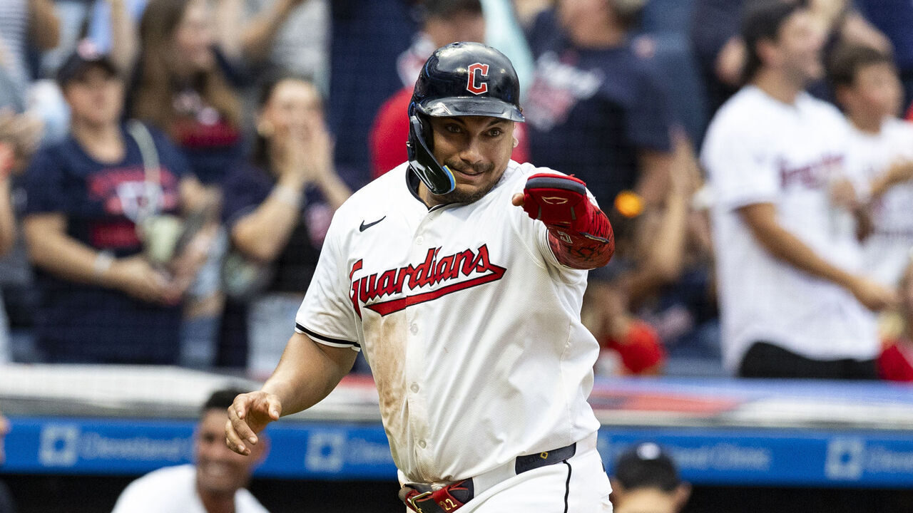 CLEVELAND, OHIO - AUGUST 1: Josh Naylor #22 of the Cleveland Guardians gestures as he scores on David Fry #6's three-run home run in the third inning of the game against the Baltimore Orioles at Progressive Field on August 1, 2024 in Cleveland, Ohio.