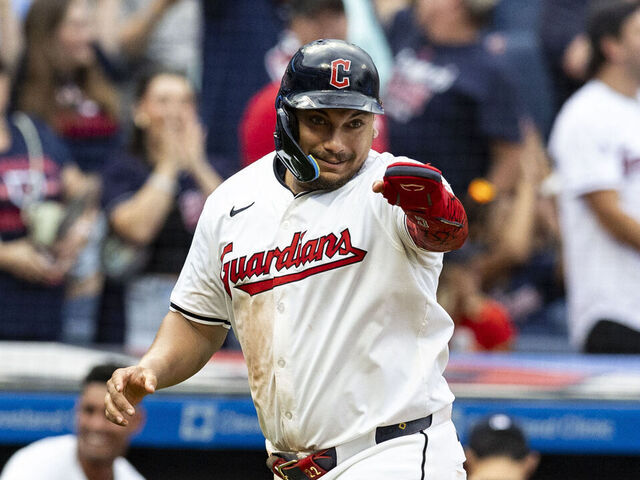 CLEVELAND, OHIO - AUGUST 1: Josh Naylor #22 of the Cleveland Guardians gestures as he scores on David Fry #6's three-run home run in the third inning of the game against the Baltimore Orioles at Progressive Field on August 1, 2024 in Cleveland, Ohio.
