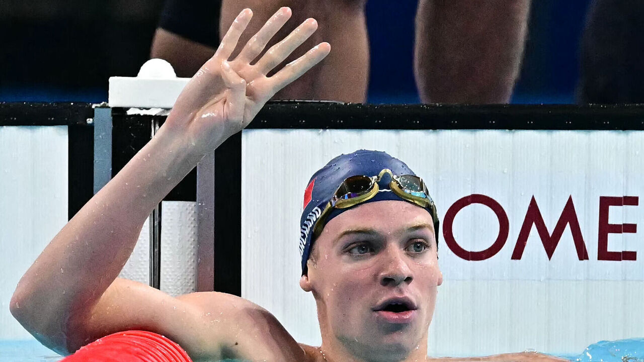 Gold medallist France's Leon Marchand gestures while celebrating after competing in the final of the men's 200m individual medley swimming event during the Paris 2024 Olympic Games at the Paris La Defense Arena in Nanterre, west of Paris, on August 2, 2024.