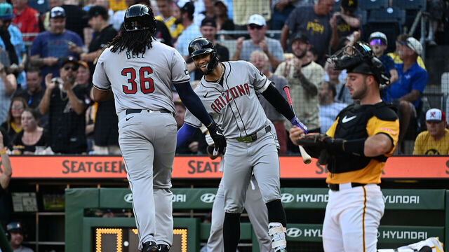 PITTSBURGH, PENNSYLVANIA - AUGUST 2: Josh Bell #36 of the Arizona Diamondbacks celebrates with Lourdes Gurriel Jr. #12 after hitting a solo home run in the first inning during the game against the Pittsburgh Pirates at PNC Park on August 2, 2024 in Pittsburgh, Pennsylvania.