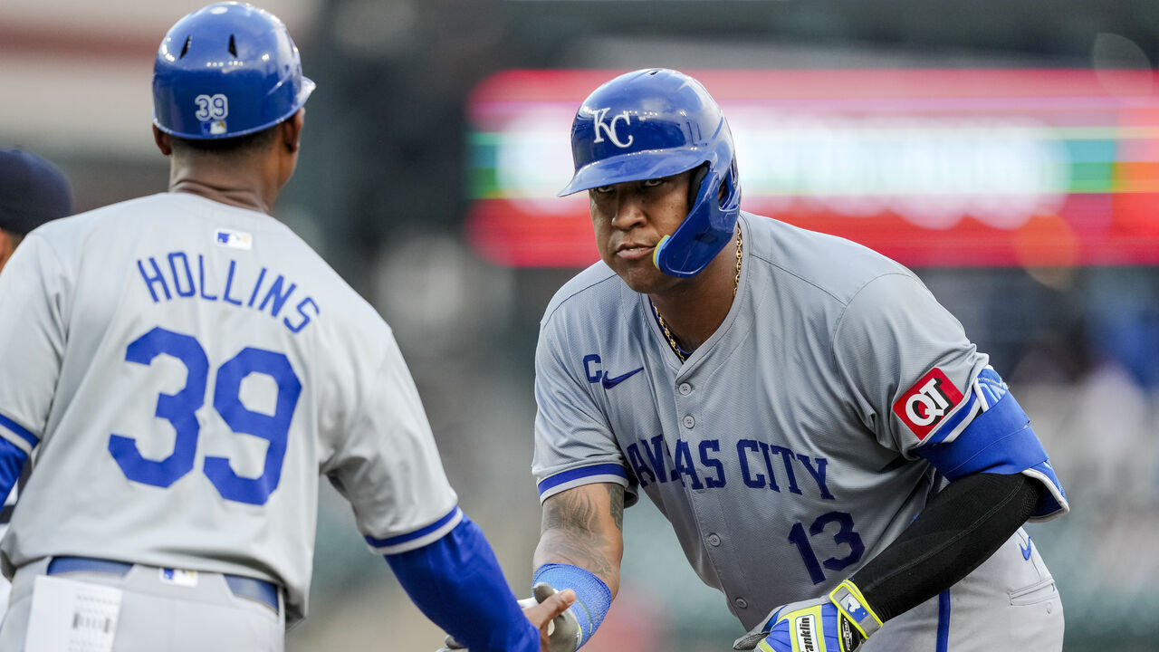 DETROIT, MICHIGAN - AUGUST 01: Salvador Perez #13 of the Kansas City Royals high fives Damon Hollins #39 of the Kansas City Royals after hitting a single against the Detroit Tigers during the top of the fourth inning at Comerica Park on August 01, 2024 in Detroit, Michigan.