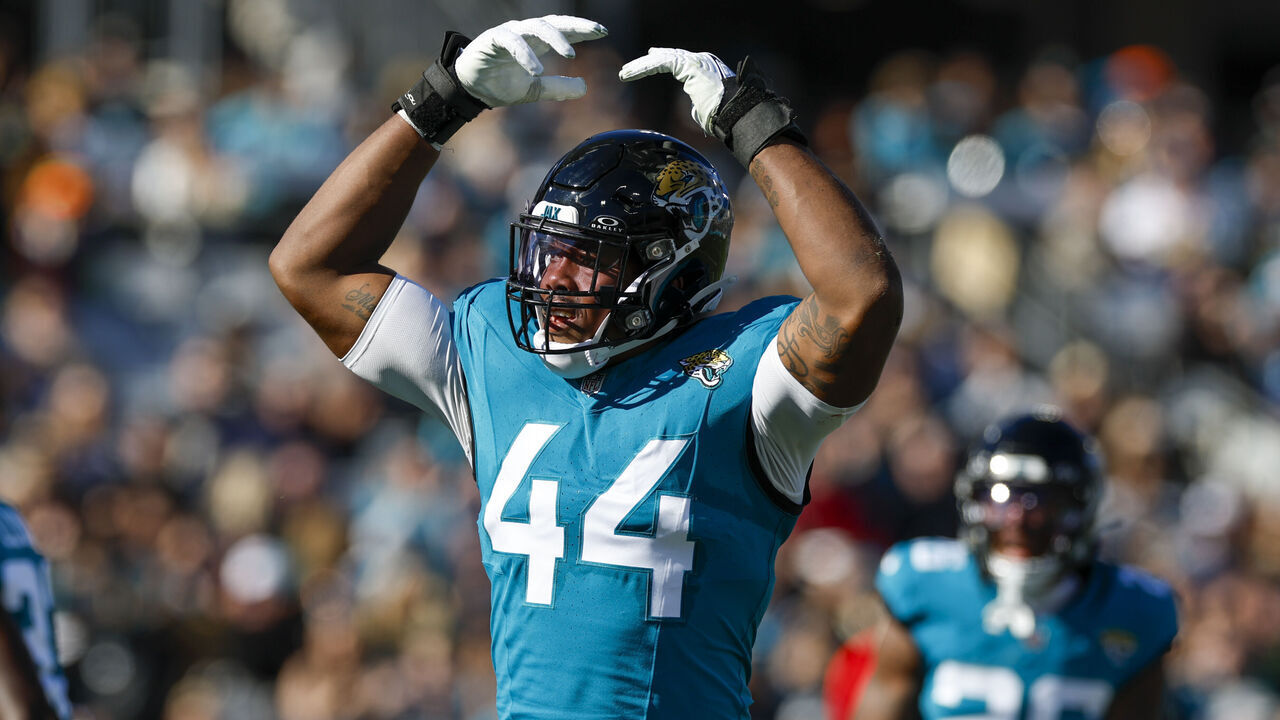 JACKSONVILLE, FL - DECEMBER 31: Jacksonville Jaguars linebacker Travon Walker (44) pumps the crowd up during the game between the Jacksonville Jaguars and the Carolina Panthers on December 31, 2023 at EverBank Stadium in Jacksonville, Fl.