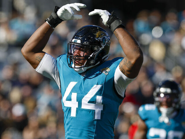 JACKSONVILLE, FL - DECEMBER 31: Jacksonville Jaguars linebacker Travon Walker (44) pumps the crowd up during the game between the Jacksonville Jaguars and the Carolina Panthers on December 31, 2023 at EverBank Stadium in Jacksonville, Fl.
