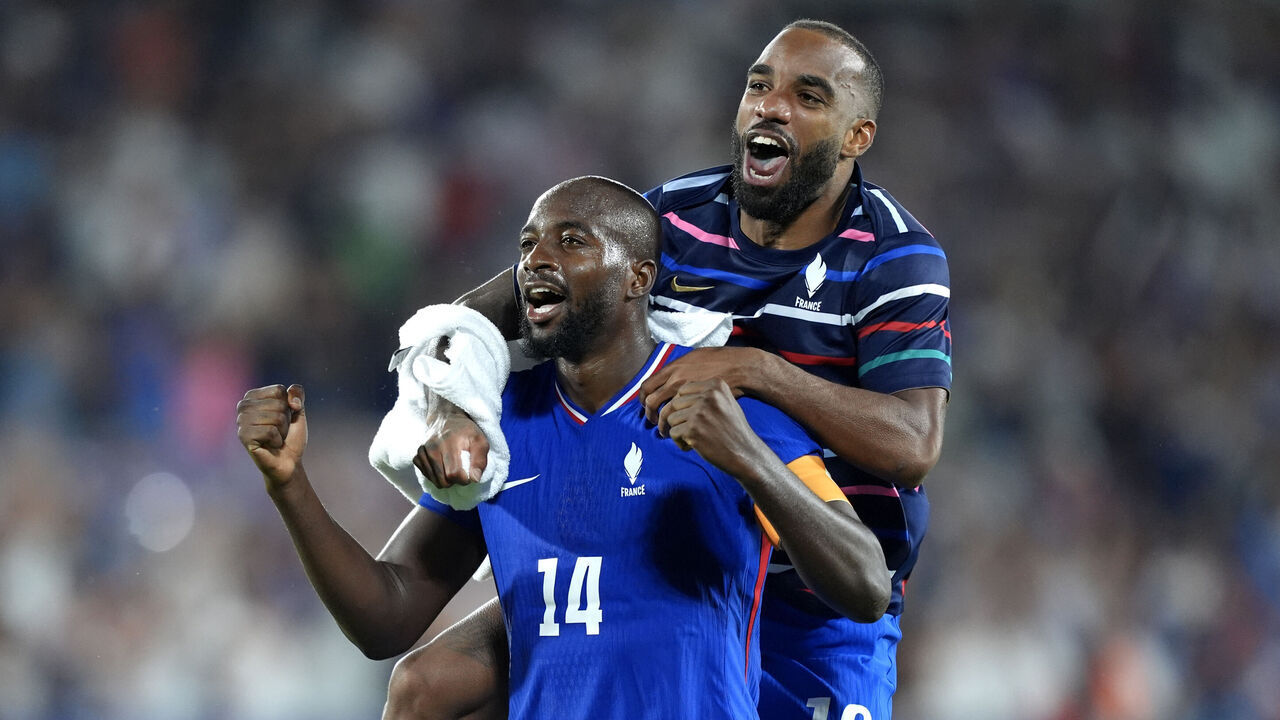 BORDEAUX, FRANCE - AUGUST 02: Jean-Philippe Mateta #14 and Alexandre Lacazette #10 of Team France celebrates victory after the Men's Quarterfinal match between France and Argentina during the Olympic Games Paris 2024 at Nouveau Stade de Bordeaux on August 02, 2024 in Bordeaux, France.