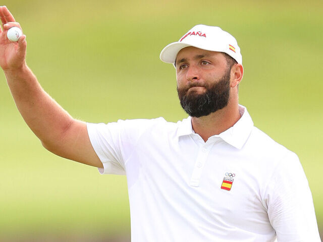PARIS, FRANCE - AUGUST 03: Jon Rahm of Team Spain acknowledges the crowd on the 18th green during Day Three of the Men's Individual Stroke Play on day eight of the Olympic Games Paris 2024 at Le Golf National on August 03, 2024 in Paris, France.