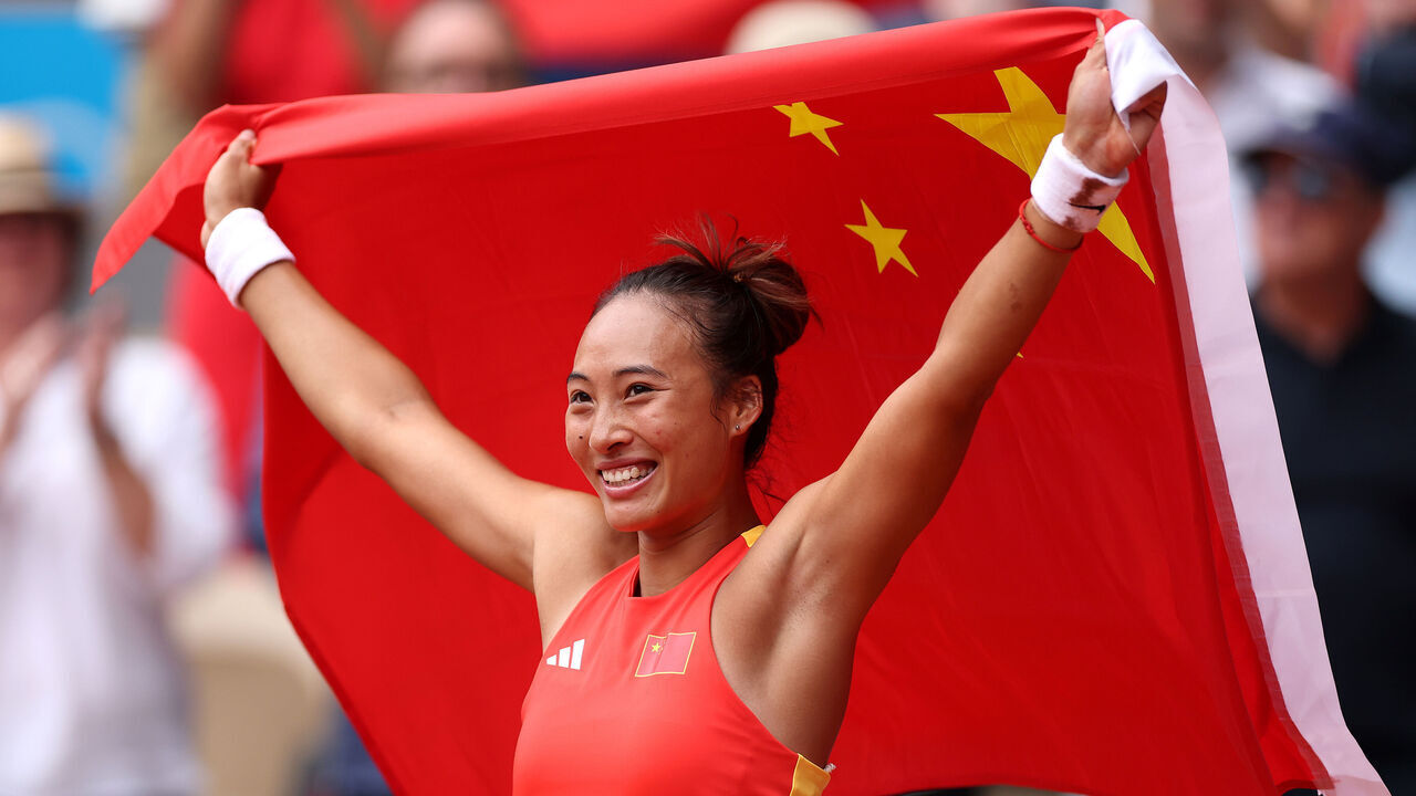 PARIS, FRANCE - AUGUST 03: Qinwen Zheng of Team People’s Republic of China celebrates match point during the Tennis Women's Singles Gold Medal match against Donna Vekic of Team Croatia on day eight of the Olympic Games Paris 2024 at Roland Garros on August 03, 2024 in Paris, France.