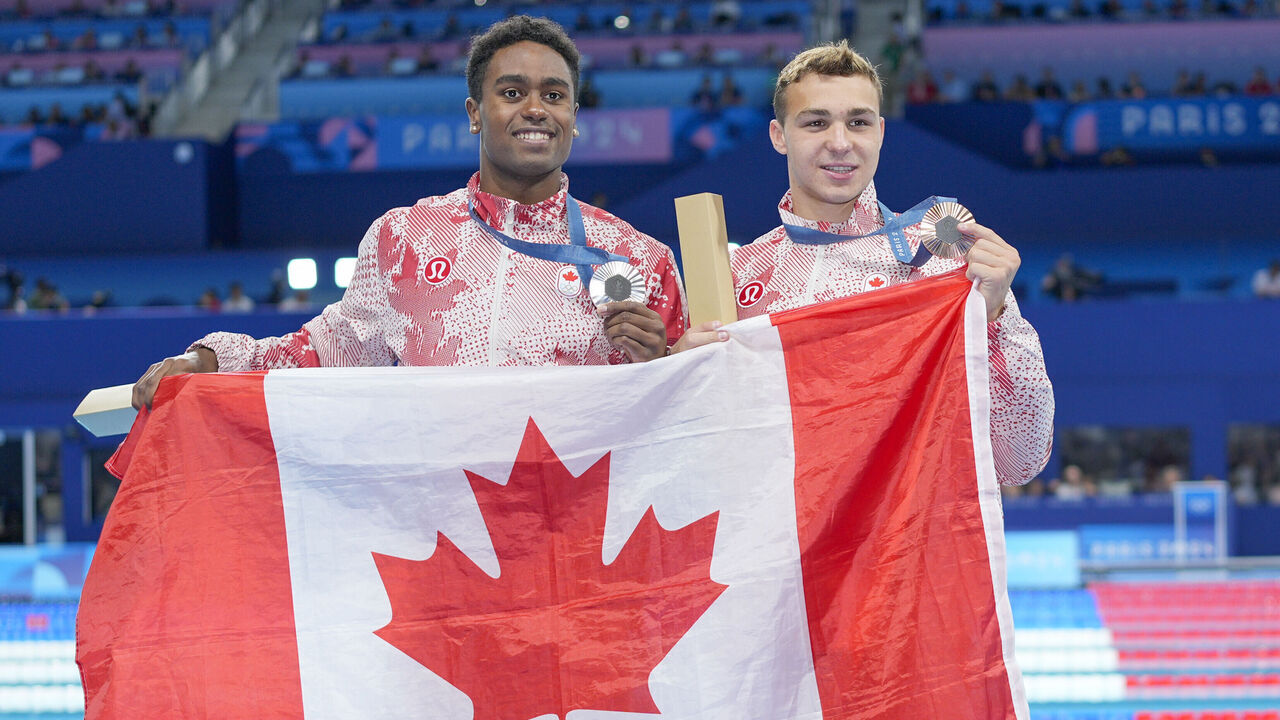 NANTERRE, FRANCE - AUGUST 3: Ilya Kharun of Canada (R) with his Bronze Medal and Josh Liendo of Canada (L) with his Silver Medal during the Men's 100m Butterfly Final on day eight of the Olympic Games Paris 2024 at Paris La Defense Arena on August 3, 2024 in Nanterre, France.
