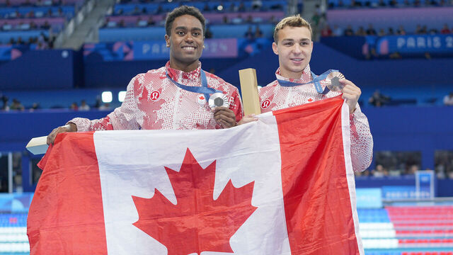 NANTERRE, FRANCE - AUGUST 3: Ilya Kharun of Canada (R) with his Bronze Medal and Josh Liendo of Canada (L) with his Silver Medal during the Men's 100m Butterfly Final on day eight of the Olympic Games Paris 2024 at Paris La Defense Arena on August 3, 2024 in Nanterre, France.