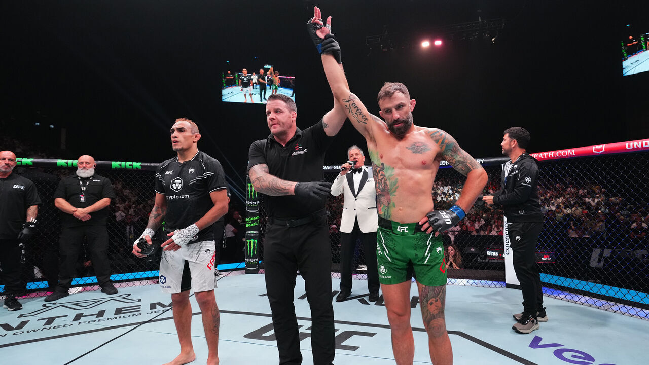ABU DHABI, UNITED ARAB EMIRATES - AUGUST 03: (R-L) Michael Chiesa reacts after defeating Tony Ferguson in a welterweight fight during the UFC Fight Night event at Etihad Arena on August 03, 2024 in Abu Dhabi, United Arab Emirates.