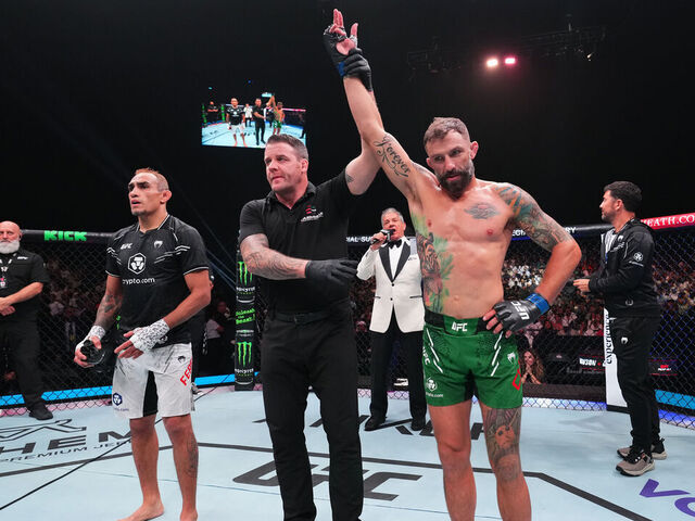 ABU DHABI, UNITED ARAB EMIRATES - AUGUST 03: (R-L) Michael Chiesa reacts after defeating Tony Ferguson in a welterweight fight during the UFC Fight Night event at Etihad Arena on August 03, 2024 in Abu Dhabi, United Arab Emirates.