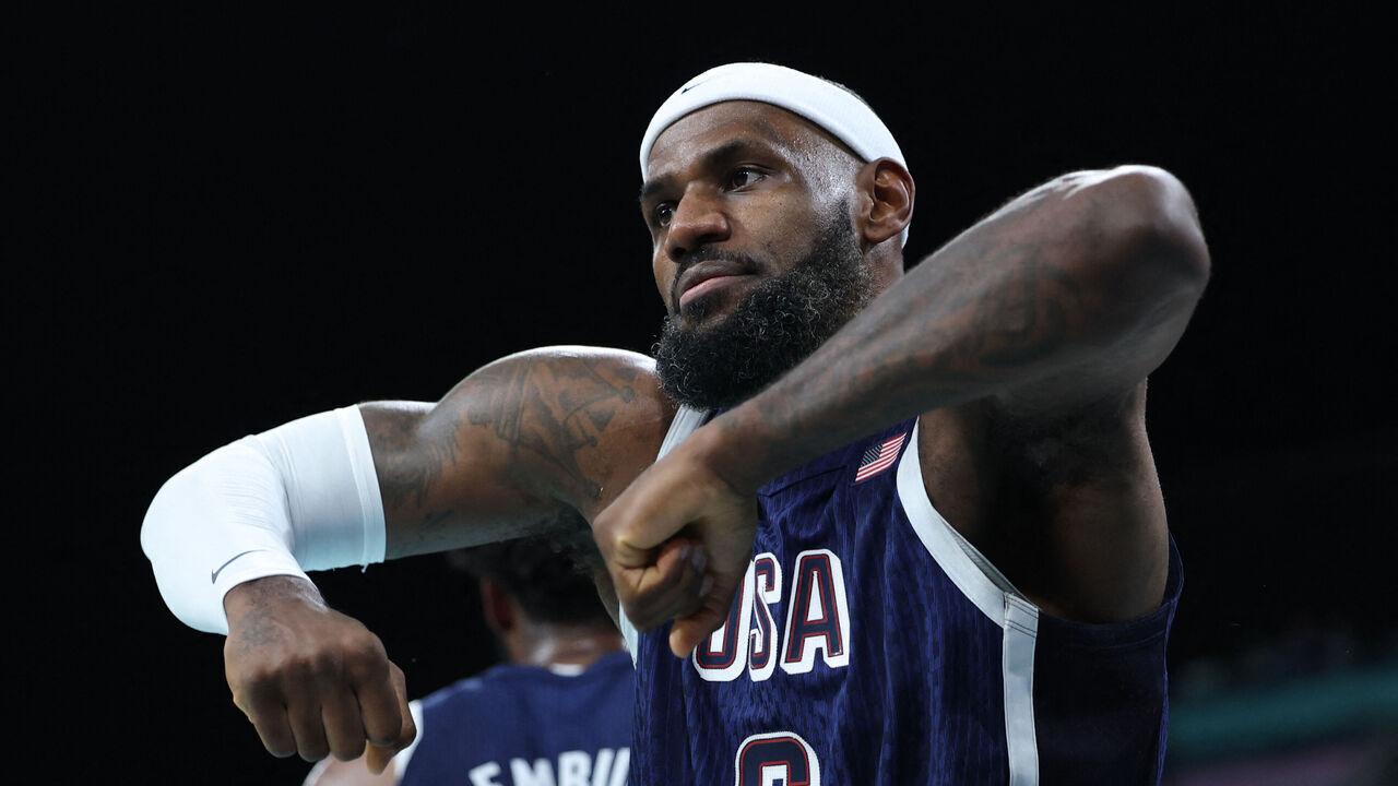 USA's #06 LeBron James reacts in the men's preliminary round group C basketball match between Puerto Rico and USA during the Paris 2024 Olympic Games at the Pierre-Mauroy stadium in Villeneuve-d'Ascq, northern France, on August 3, 2024.
