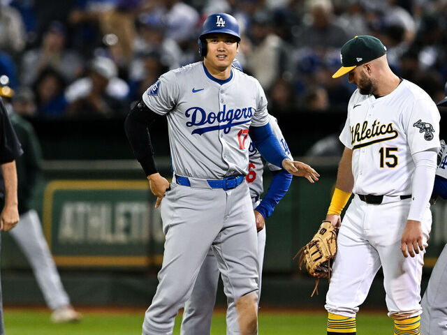 OAKLAND, CALIFORNIA - AUGUST 03: Shohei Ohtani #17 of Los Angeles Dodgers reacts after hitting a single in the top of the ninth inning during the regular season game against the Oakland Athletics at the Oakland Coliseum on August 3, 2024 in Oakland, California.