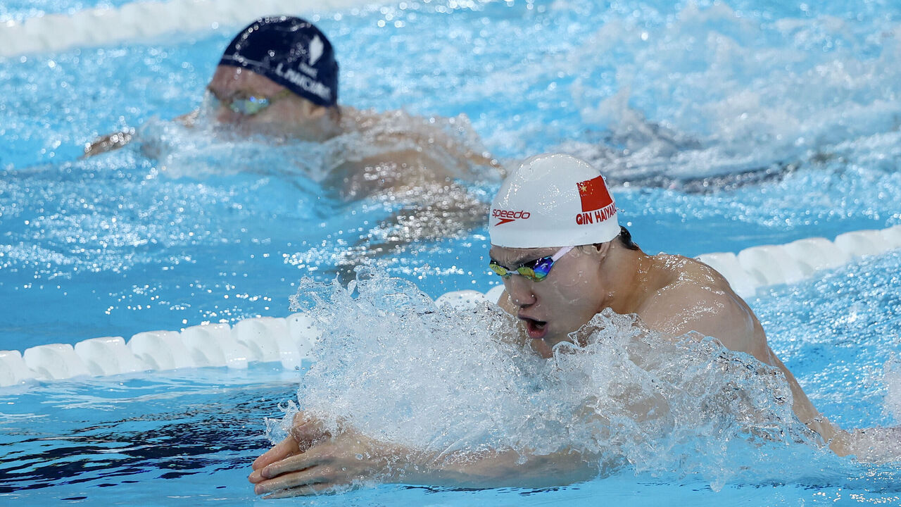 NANTERRE, FRANCE - AUGUST 04: Haiyang Qin of Team People's Republic of China competes in the Men's 4x100m Medley Relay Final on day nine of the Olympic Games Paris 2024 at Paris La Defense Arena on August 04, 2024 in Nanterre, France.
