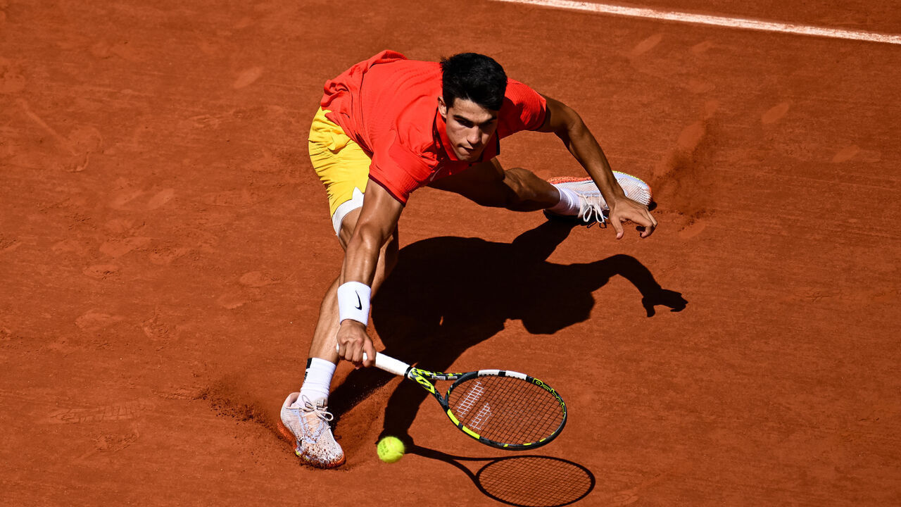 PARIS, FRANCE - AUGUST 04: Carlos Alcaraz of Spain in action against Novak Djokovic of Serbia in the Men's Singles Gold medal match on day nine of the Olympic Games Paris 2024 at Roland Garros on August 04, 2024 in Paris, France.