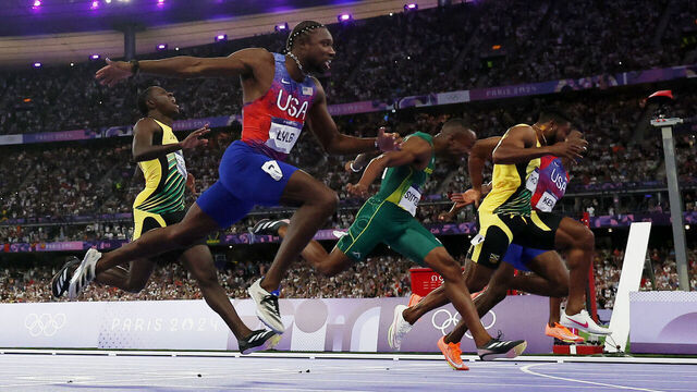 PARIS, FRANCE - AUGUST 04: Noah Lyles of Team United States crosses the finish line during the Men's 100m Final on day nine of the Olympic Games Paris 2024 at Stade de France on August 04, 2024 in Paris, France.