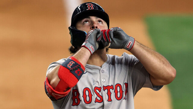 ARLINGTON, TEXAS - AUGUST 04: Wilyer Abreu #52 of the Boston Red Sox reacts at home plate after hitting a home run against the Texas Rangers in the fourth inning at Globe Life Field on August 04, 2024 in Arlington, Texas.