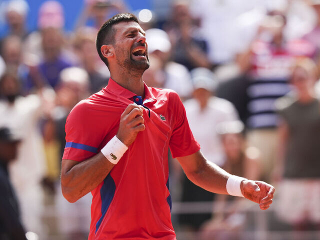 SAINT-DENIS, FRANCE - AUGUST 4: Novak Djokovic of Team Serbia celebrates after winning the gold medal over Carlos Alcaraz of Team Spain in the Men's Singles Tennis at Roland Garros during the Paris 2024 Olympics on August 4, 2024.