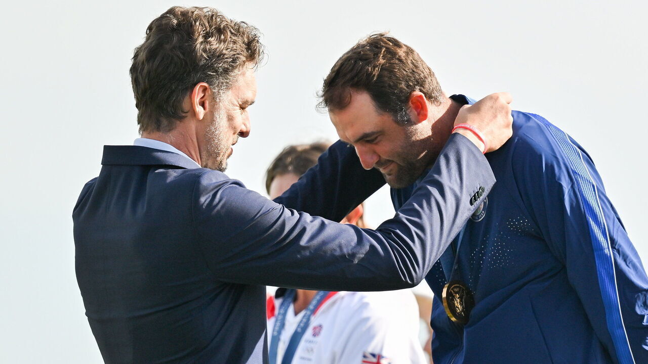 Paris , France - 4 August 2024; Scottie Scheffler of Team United States receives his gold medal from IOC member Pau Gasol Saez after the men's individual stroke play final round at Le Golf National during the 2024 Paris Summer Olympic Games in Paris, France.