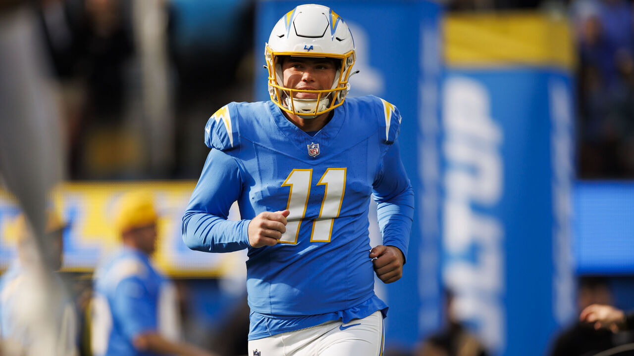 INGLEWOOD, CALIFORNIA - JANUARY 07: Cameron Dicker #11 of the Los Angeles Chargers runs out during player introductions before an NFL football game against the Kansas City Chiefs at SoFi Stadium on January 7, 2024 in Inglewood, California.
