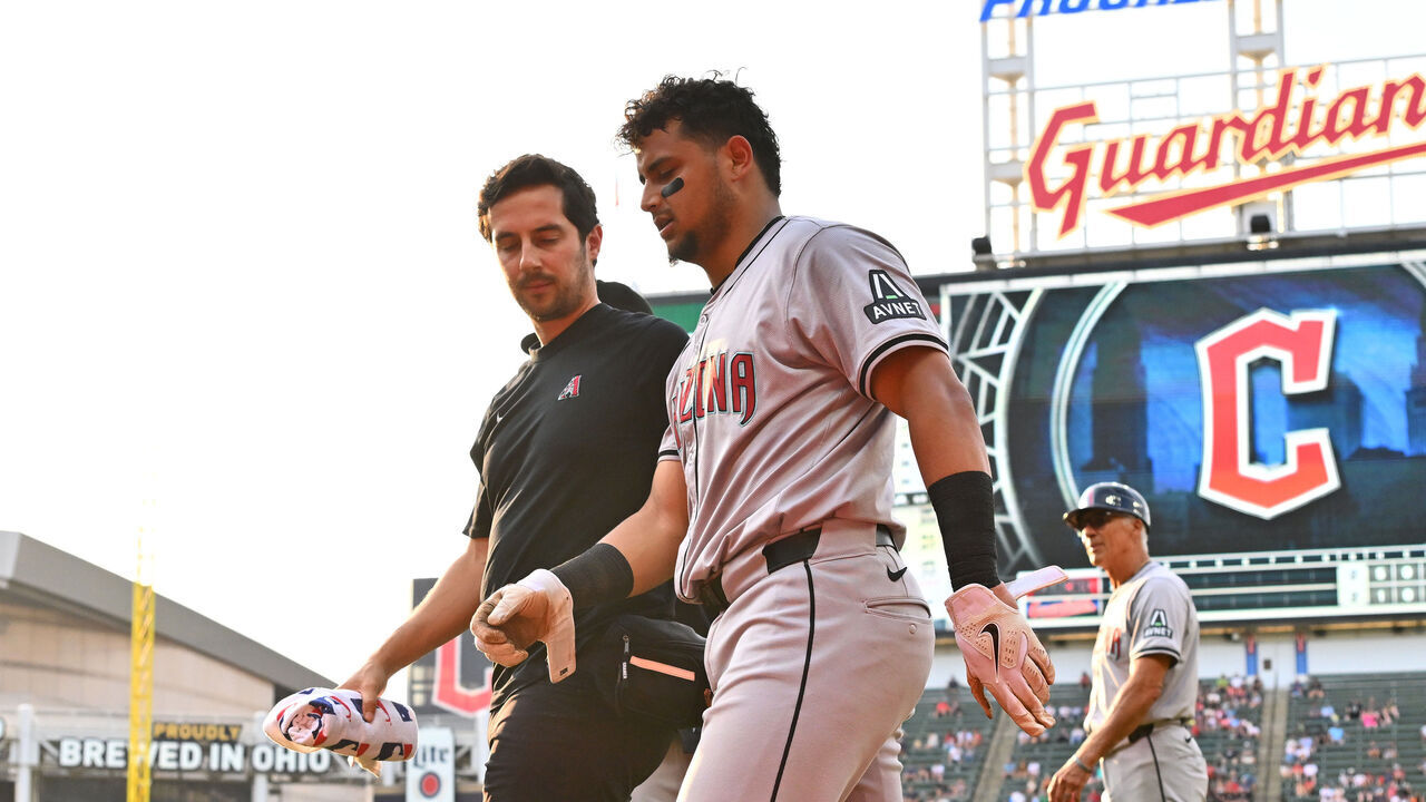 CLEVELAND, OHIO - AUGUST 05: Gabriel Moreno #14 of the Arizona Diamondbacks walks off the field after an injury IN the second inning against the Cleveland Guardians at Progressive Field on August 05, 2024 in Cleveland, Ohio.