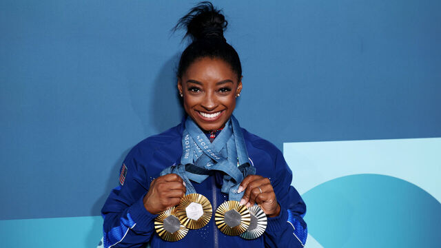 PARIS, FRANCE - AUGUST 05: Simone Biles of Team United States poses with her Paris 2024 Olympic medals following the Artistic Gymnastics Women's Floor Exercise Final on day ten of the Olympic Games Paris 2024 at Bercy Arena on August 05, 2024 in Paris, France.