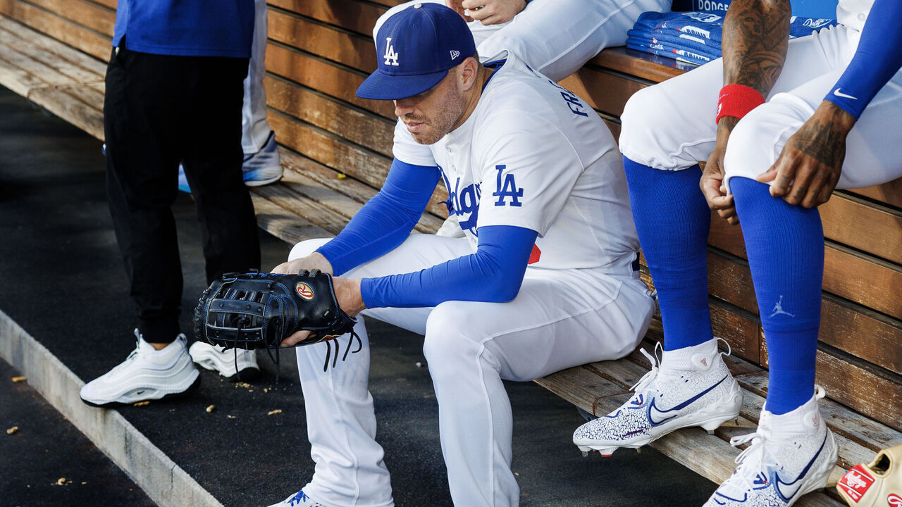 LOS ANGELES, CA - JULY 23, 2024: Los Angeles Dodgers first base Freddie Freeman (5) sits on the bench with his teammates before the game against the San Francisco Giants at Dodgers Stadium on July 23, 2024 in Los Angeles, California. His mind is on his family, namely his 3-year-old son who is in the hospital.(Gina Ferazzi / Los Angeles Times via Getty Images)
