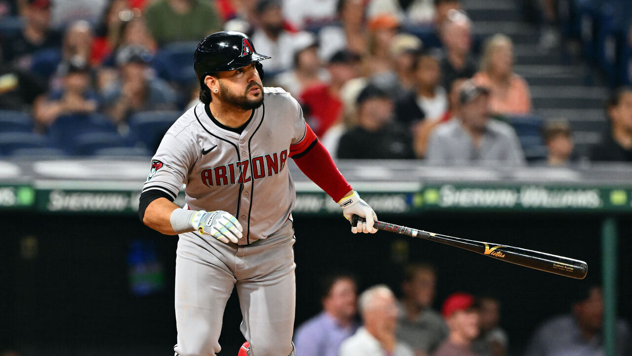 CLEVELAND, OHIO - AUGUST 05: Eugenio Suárez #28 of the Arizona Diamondbacks hits an RBI sacrifice fly in the 10th inning against the Cleveland Guardians at Progressive Field on August 05, 2024 in Cleveland, Ohio. The Diamondbacks won 7-6 in 10 innings.