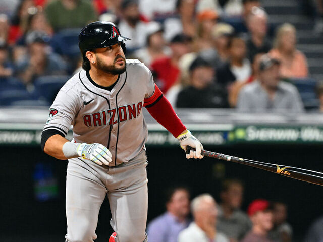 CLEVELAND, OHIO - AUGUST 05: Eugenio Suárez #28 of the Arizona Diamondbacks hits an RBI sacrifice fly in the 10th inning against the Cleveland Guardians at Progressive Field on August 05, 2024 in Cleveland, Ohio. The Diamondbacks won 7-6 in 10 innings.