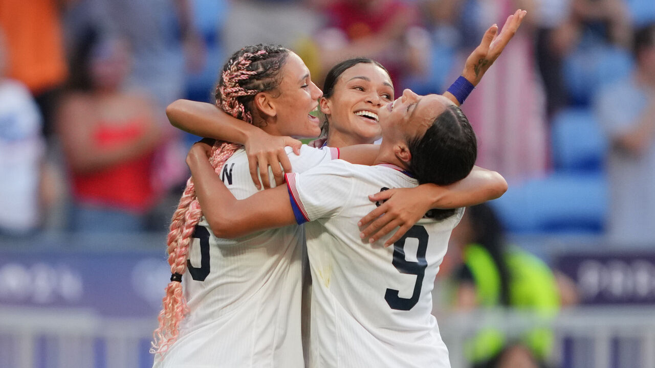 LYON, FRANCE - AUGUST 06: Sophia Smith #11 of the United States celebrates scoring with teammates during extra time against Germany during the Women's semifinal match during the Olympic Games Paris 2024 at Stade de Lyon on August 06, 2024 in Lyon, France.