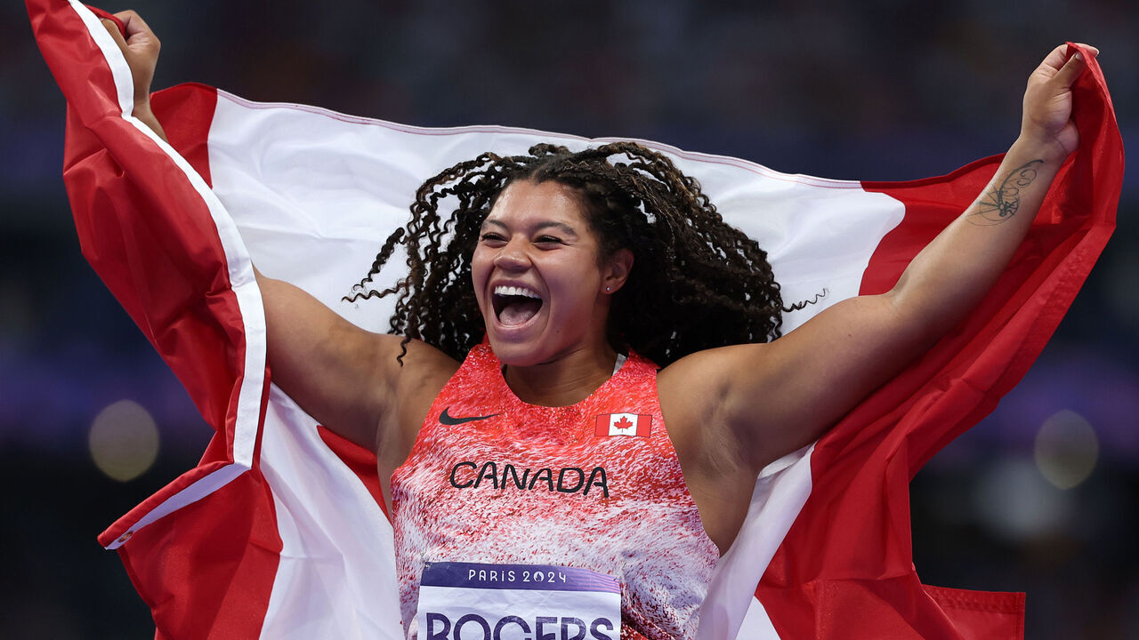 PARIS, FRANCE - AUGUST 06: Gold medalist Camryn Rogers of Team Canada celebrates after competing in the Women's Hammer Throw Final on day eleven of the Olympic Games Paris 2024 at Stade de France on August 06, 2024 in Paris, France.