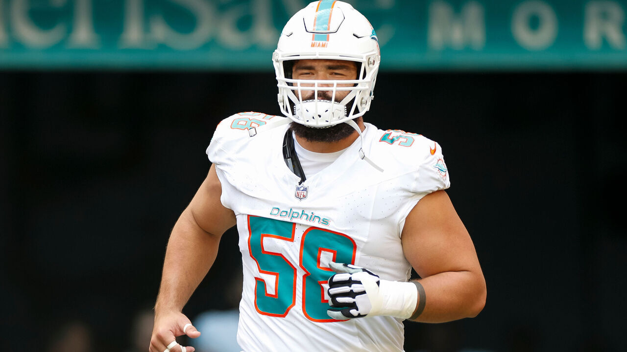 MIAMI GARDENS, FLORIDA - OCTOBER 8: Connor Williams #58 of the Miami Dolphins runs out of the tunnel during player introductions prior to a game against the New York Giants at Hard Rock Stadium on October 8, 2023 in Miami Gardens, Florida.