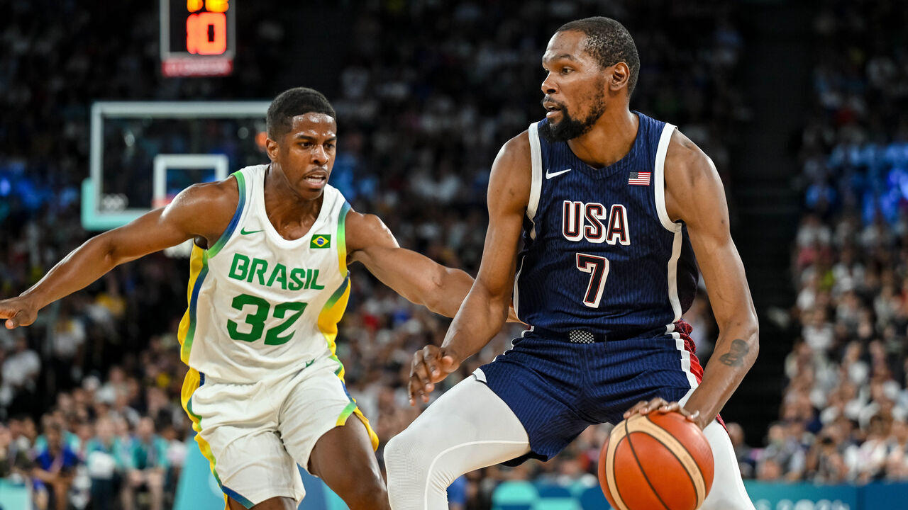 Georginho de Paula of Brazil and Kevin Durant of USA battle for the ball during the Men's Basketball Quarterfinal match between Brazil and United State on Day 11 of the Olympic Games Paris 2024 at Bercy Arena on August 6, 2024 in Paris, France.