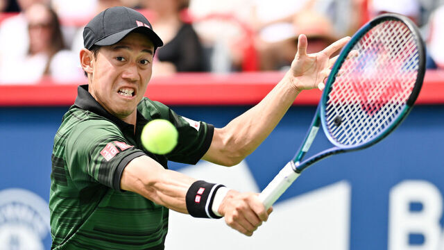 MONTREAL, CANADA - AUGUST 06: Kei Nishikori of Japan plays a backhand against Alex Michelsen of the United States in the Men's Singles first round match during Day One of the ATP Masters 1000 National Bank Open at Stade IGA on August 6, 2024 in Montreal, Canada.