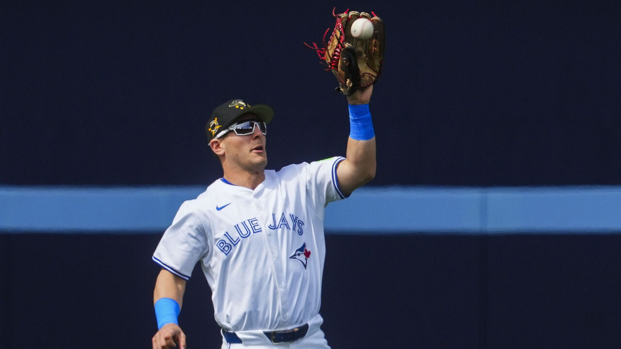 TORONTO, ON - MAY 18: Daulton Varsho #25 of Toronto Blue Jays fields a ball against the Tampa Bay Rays during the first inning in their MLB game at the Rogers Centre on May 18, 2024 in Toronto, Ontario, Canada.