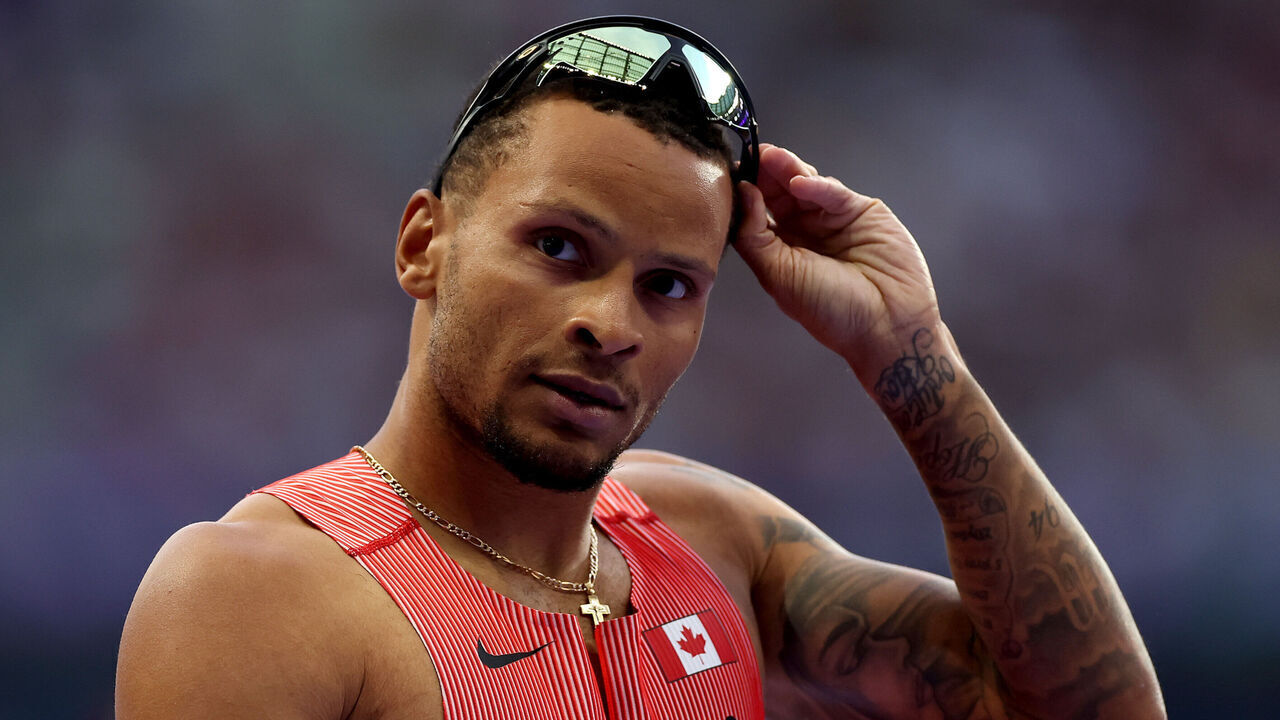 PARIS, FRANCE - AUGUST 07: Andre De Grasse of Team Canada reacts competes in the Men's 200m Semi-Final on day twelve of the Olympic Games Paris 2024 at Stade de France on August 07, 2024 in Paris, France.