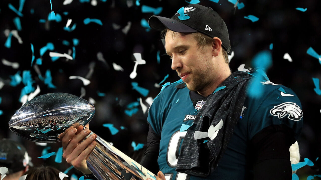 MINNEAPOLIS, MN - FEBRUARY 04: Nick Foles #9 of the Philadelphia Eagles celebrates with the Lombardi Trophy after defeating the New England Patriots 41-33 in Super Bowl LII at U.S. Bank Stadium on February 4, 2018 in Minneapolis, Minnesota.