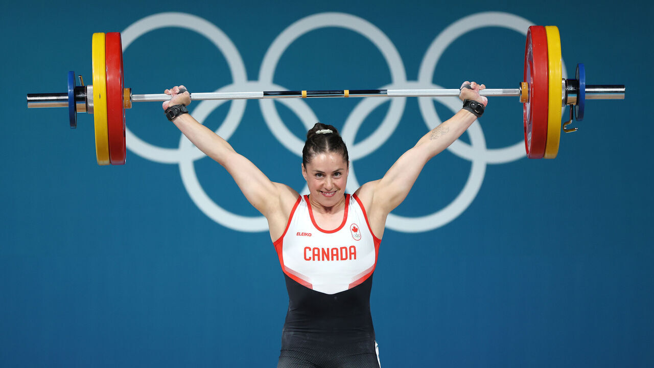 PARIS, FRANCE - AUGUST 08: Maude Charron of Team Canada performs a snatch during the Weightlifting Women's 59kg on day thirteen of the Olympic Games Paris 2024 at South Paris Arena on August 08, 2024 in Paris, France.
