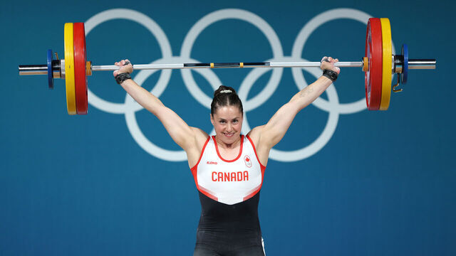 PARIS, FRANCE - AUGUST 08: Maude Charron of Team Canada performs a snatch during the Weightlifting Women's 59kg on day thirteen of the Olympic Games Paris 2024 at South Paris Arena on August 08, 2024 in Paris, France.