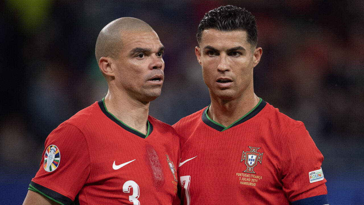 HAMBURG, GERMANY - JULY 5: Pepe and Cristiano Ronaldo of Portugal during the UEFA EURO 2024 quarter-final match between Portugal and France at Volksparkstadion on July 5, 2024 in Hamburg, Germany.