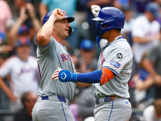 DENVER, CO - AUGUST 8: Mark Vientos #27 of the New York Mets (R) is congratulated by Pete Alonso #20 after hitting a two run home run during the fifth inning against the Colorado Rockies at Coors Field on August 8, 2024 in Denver, Colorado.